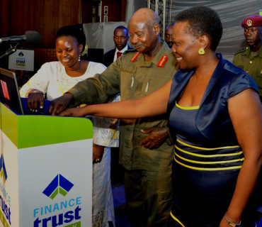 President Museveni launching Finance Trust bank. Right is Ms. Irene Muloni