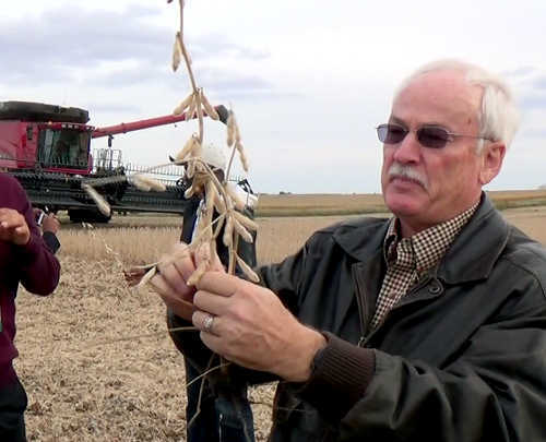 American soy farmer Ron Heck showing visitng journalists how he harvests the crop using a Combine