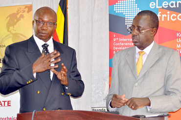 ICT Minister John Nasasira (r) with UCC Communications boss Fred Otunu