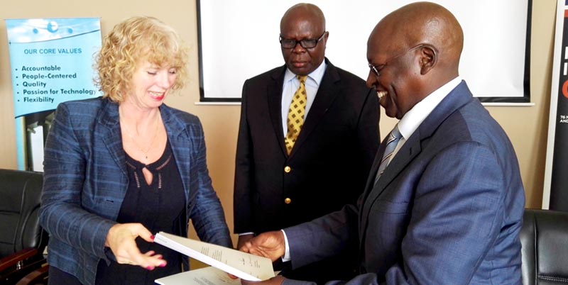 UK BOOSTS ENTEBBE AIRPORT SECURITY: British High Commissioner to Uganda Alison Blackburne exchange transfer agreements with Civial Aviation Managing Director Dr. Rama Makuza at the handover of improvised Explosive Devices Training Kits (IED’s), looking on is minister of state for transport Steven Chebrot