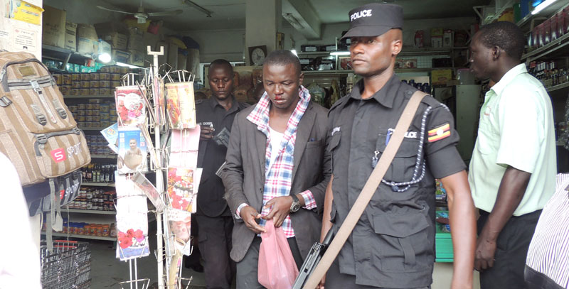 This thief being led away by a Police officer was nabbed shoplifting at Homecare Supermarket on Dewinton road