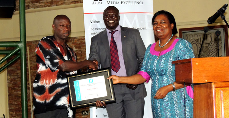 The Sunrise Editor Henry Lutaaya receiving his Award for excellence