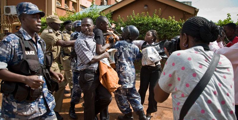 Journalists scuffle with the Police