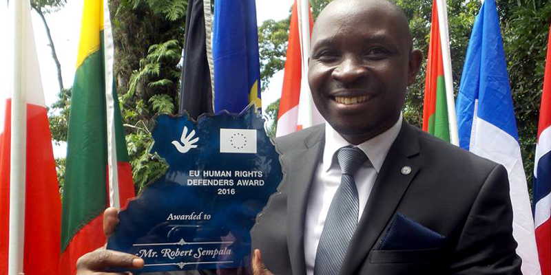 Robert Ssempala shows his award, fruits of hard work