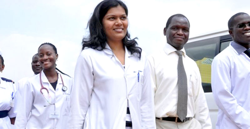 The Director of the Uganda Cancer Institute Dr. Jackson Orem (In tie) flanked by some of the staff of the institute. Disclaimer: Dr. Orem did not make specific reference to any of the staff in the photo