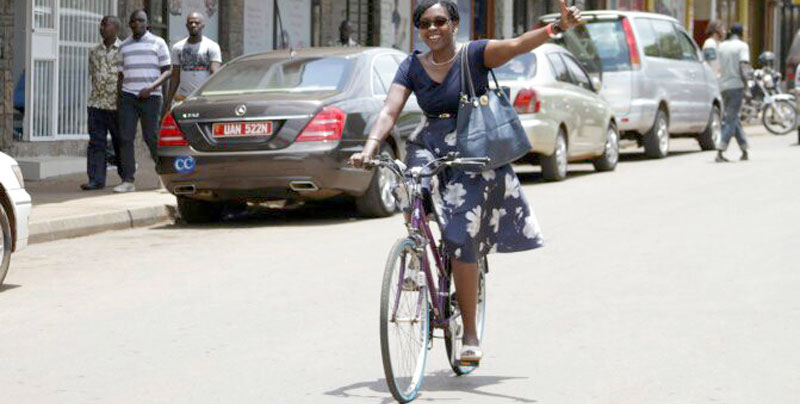 (courtesy photo) :Woman riding a bike on Kampala Streets