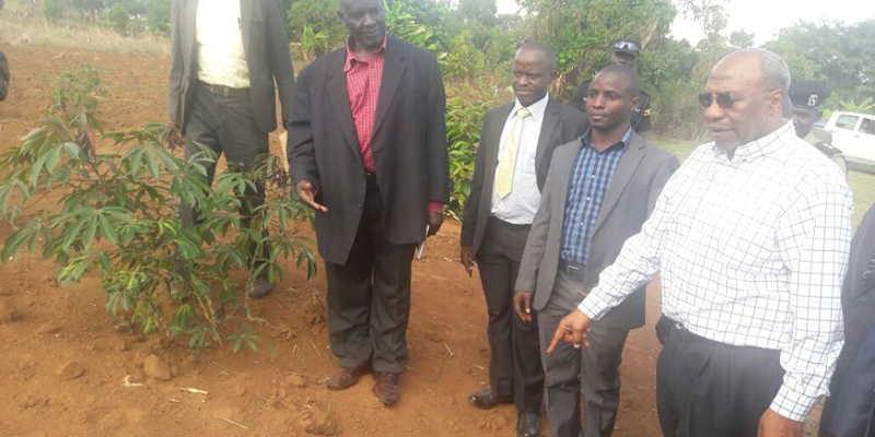 Prime Minister Dr. Ruhakana Rugunda with leaders in Masaka region inspecting drought-stricken Cassava gardens