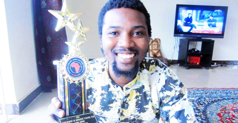 Playwrite Zziwa displays his award