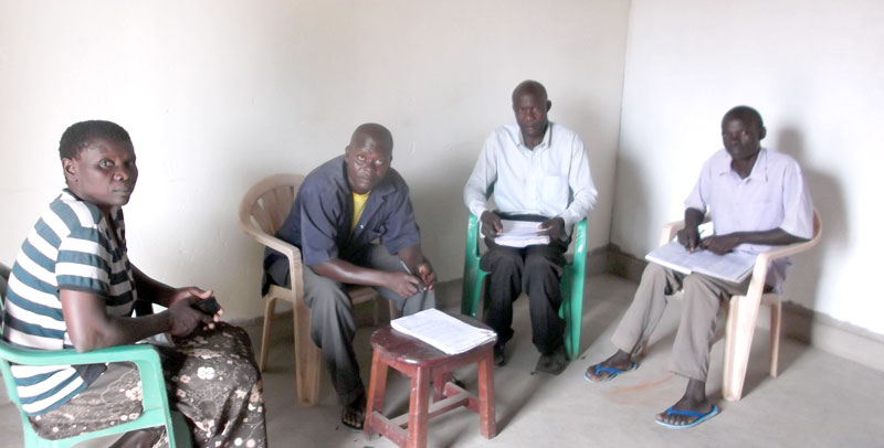 The Executive members of Iyadeli SACCO in a meeting on loan applications.