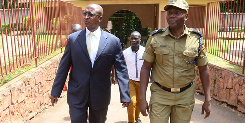 Minister Kabafunzaki in being led away by Police