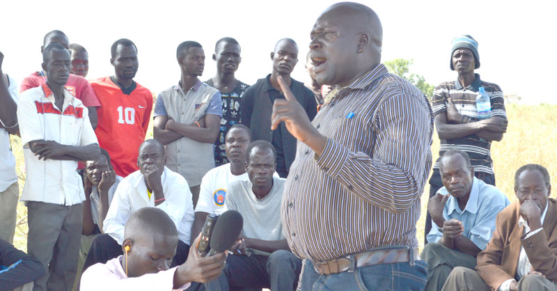 Patrick Okello Oryema LC5 Chairman Nwoya District explaining to residents