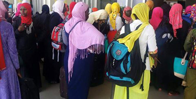 Maids at Entebbe International Airport ready to leave for the Middle East