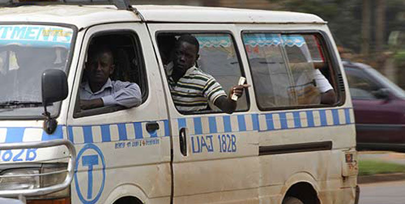 A taxi conductor calling passengers