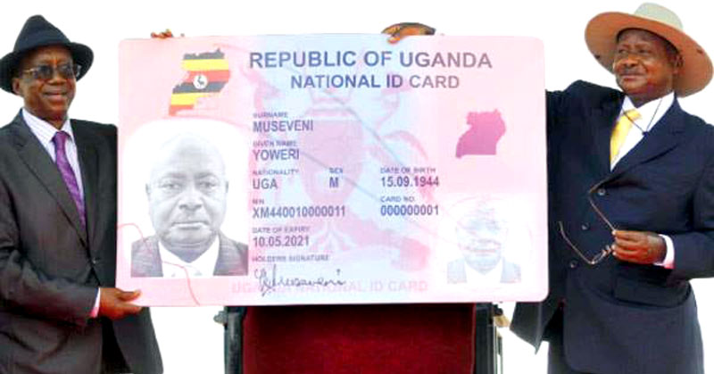 President Museveni holds a national ID dummy