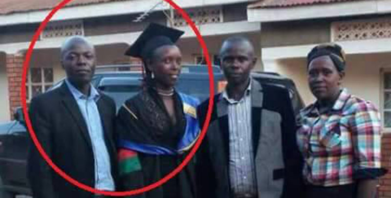 Edward Kisuze the accused (r) standing next to his accuser during her graduation