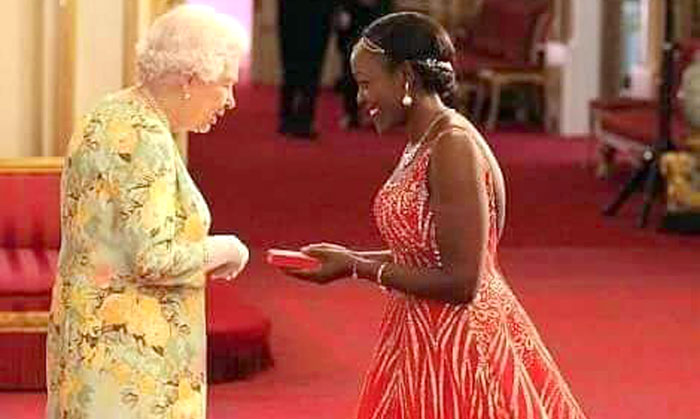 Elizabeth-Kasujja-receives-her-award-from-HM-Queen-Elizabeth-II–(Source-Elizabeth-Kasujja)