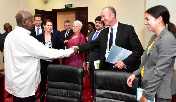 President Yoweri Museveni shakes hands with US Trade Agency officials at State House in Entebbe
