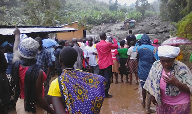 Buduuda residents look at the aftermath of the landslides