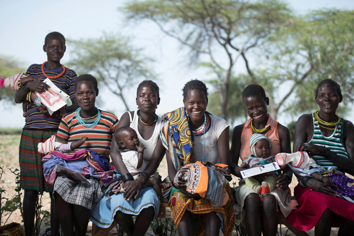 Karimajong women take their children for immunisation