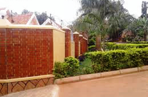 Perimeter walls which don areas like Naguru