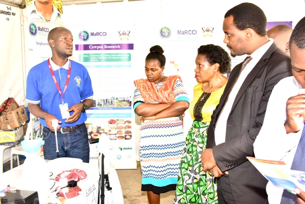 Clerk to Parliament Jane Kibirige 2nd right visiting a stall by MUK department of food science during the Parliament Week last month