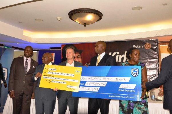 L-R rotary blood bank chairperson Katongole, MTN CEO Wim vanhellepute, CEO stanbic Bank Patrick Mweheire and the Rotary Uganda President