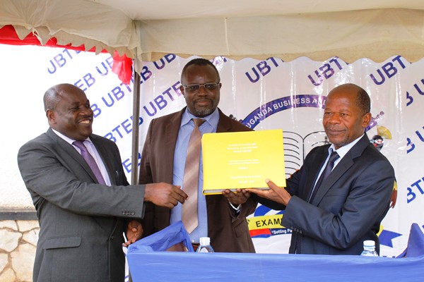 L-R Onesmus Oyesigye the executive director UBTEB, Board chairman UBTEB Prof. VEnasius Baryamureba Minister JohnC Muyingo