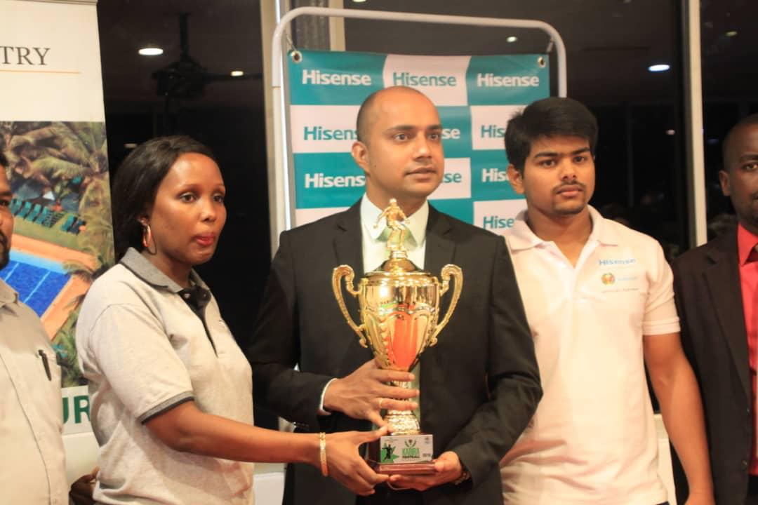 Rakesh (M) holding a trophy