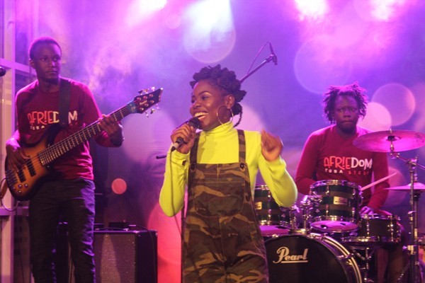 Afrie performing with her band