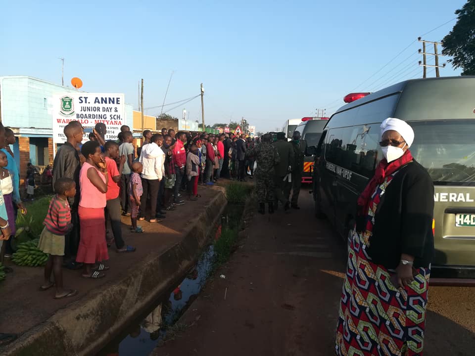Hundreds of mourners thronged the roadsides from Mityana right up to Nkene where Gen. Ggwanga was laid to rest